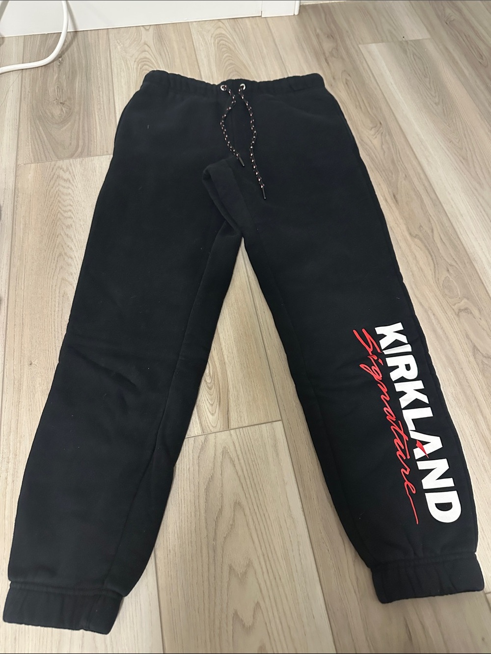 Kirkland Signature Black Joggers with White & Red Logo